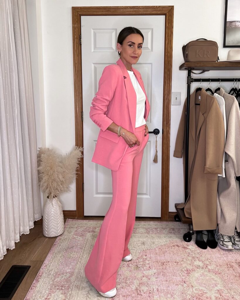 Karina wears Express pink twill suit