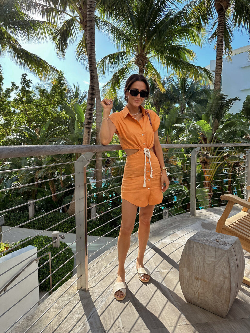 Karina wears Hevron orange linen dress with Nisolo Sandals and Celine sunnies