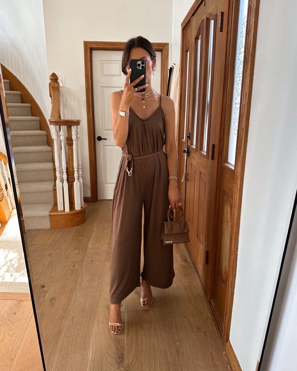 Karina wear brown Amazon jumpsuit with Jacquemus bag