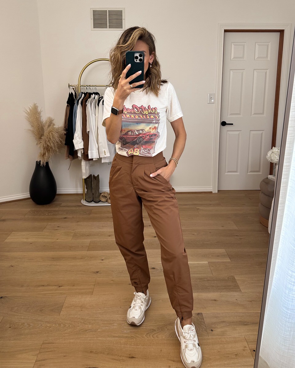 Graphic tee styled with brown trousers