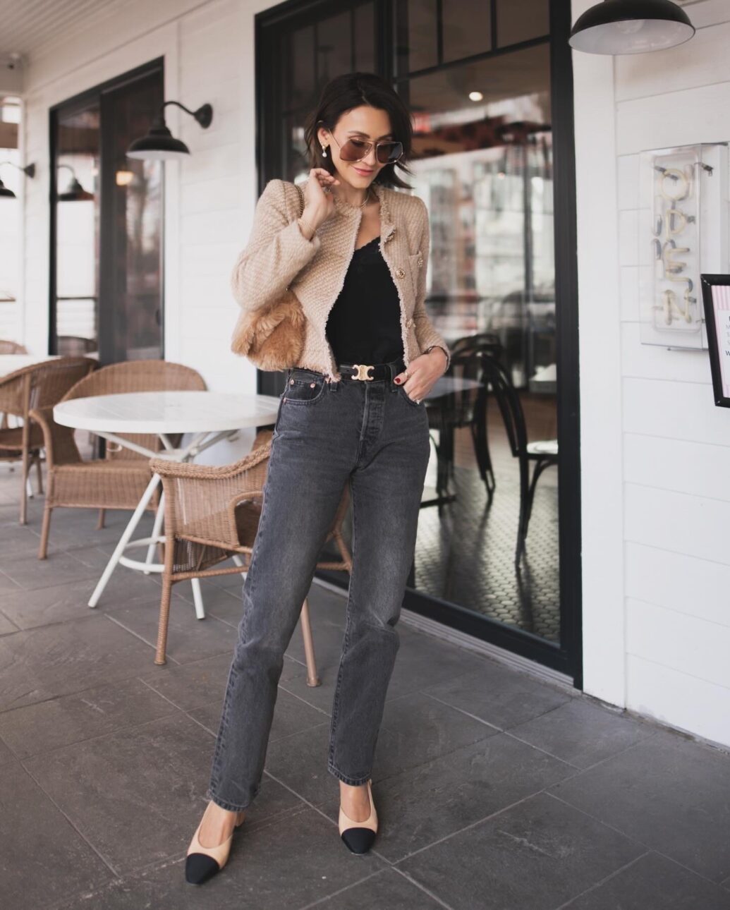 black jean outfit with a black tank and tweed jacket