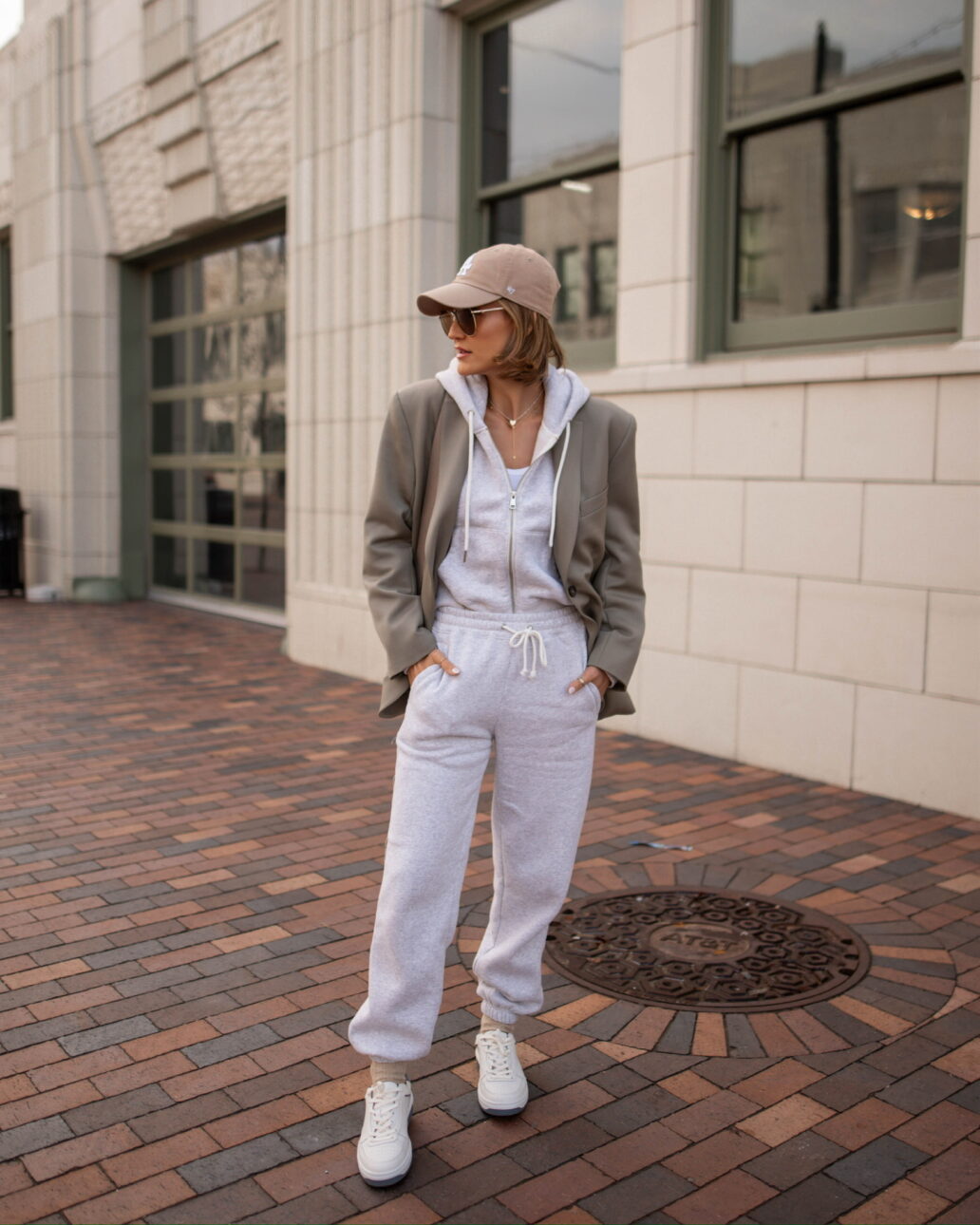 white sneaker outfit with a blazer and a sweatshirt and sweatpants
