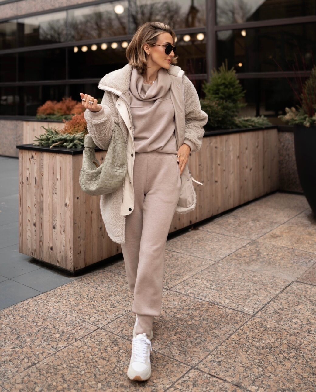 white sneaker outfit with loungewear and a sherpa jacket