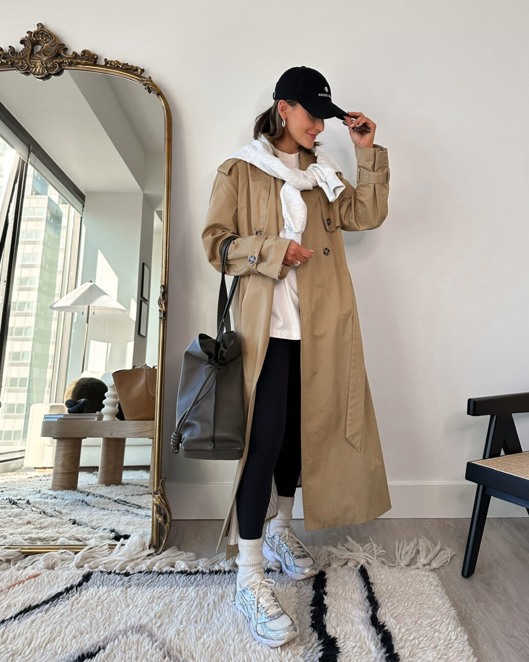 trench coat outfit with athleisure and dad sneakers