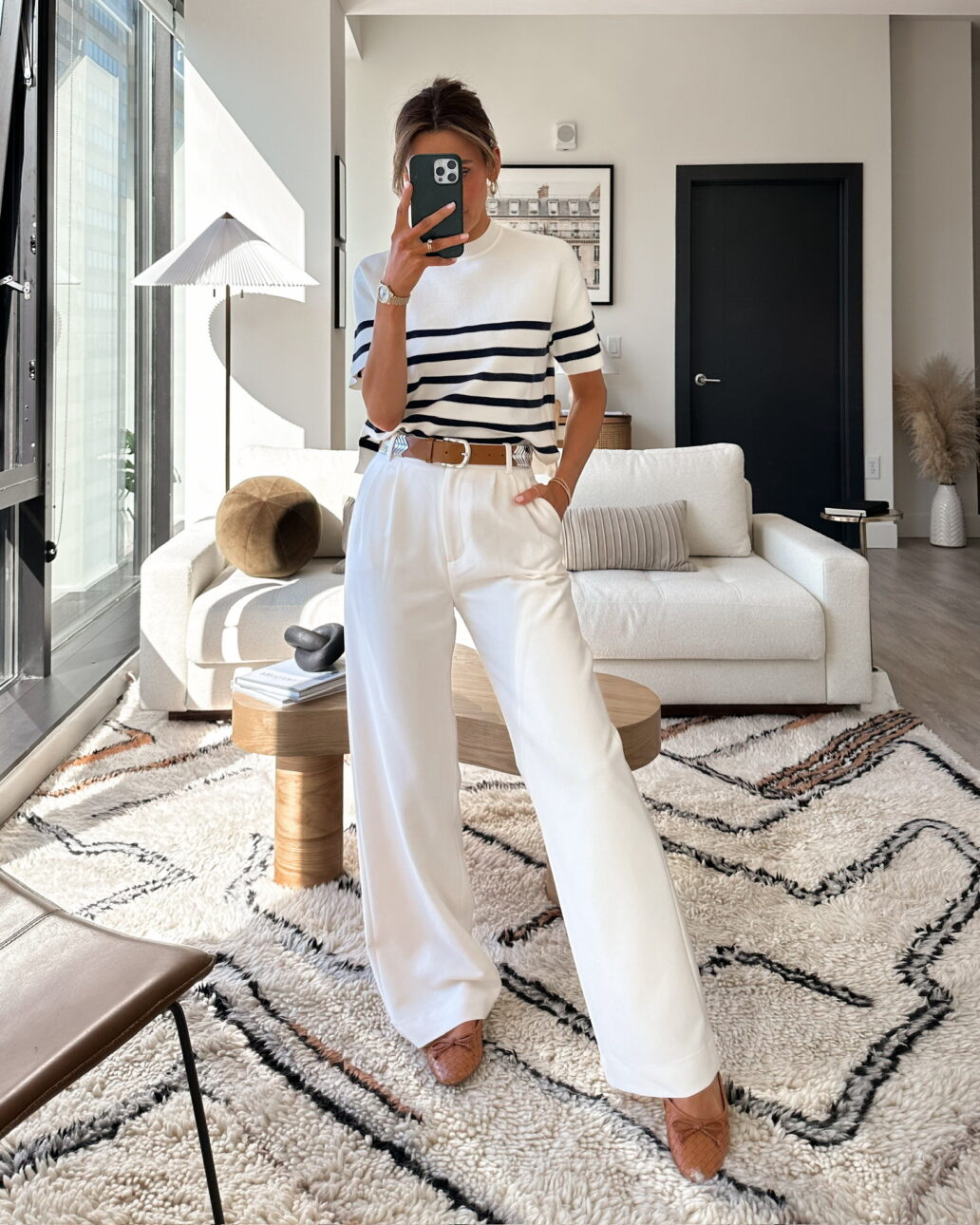trouser outfit with ballet flats, a striped sweater tee, and a leather belt