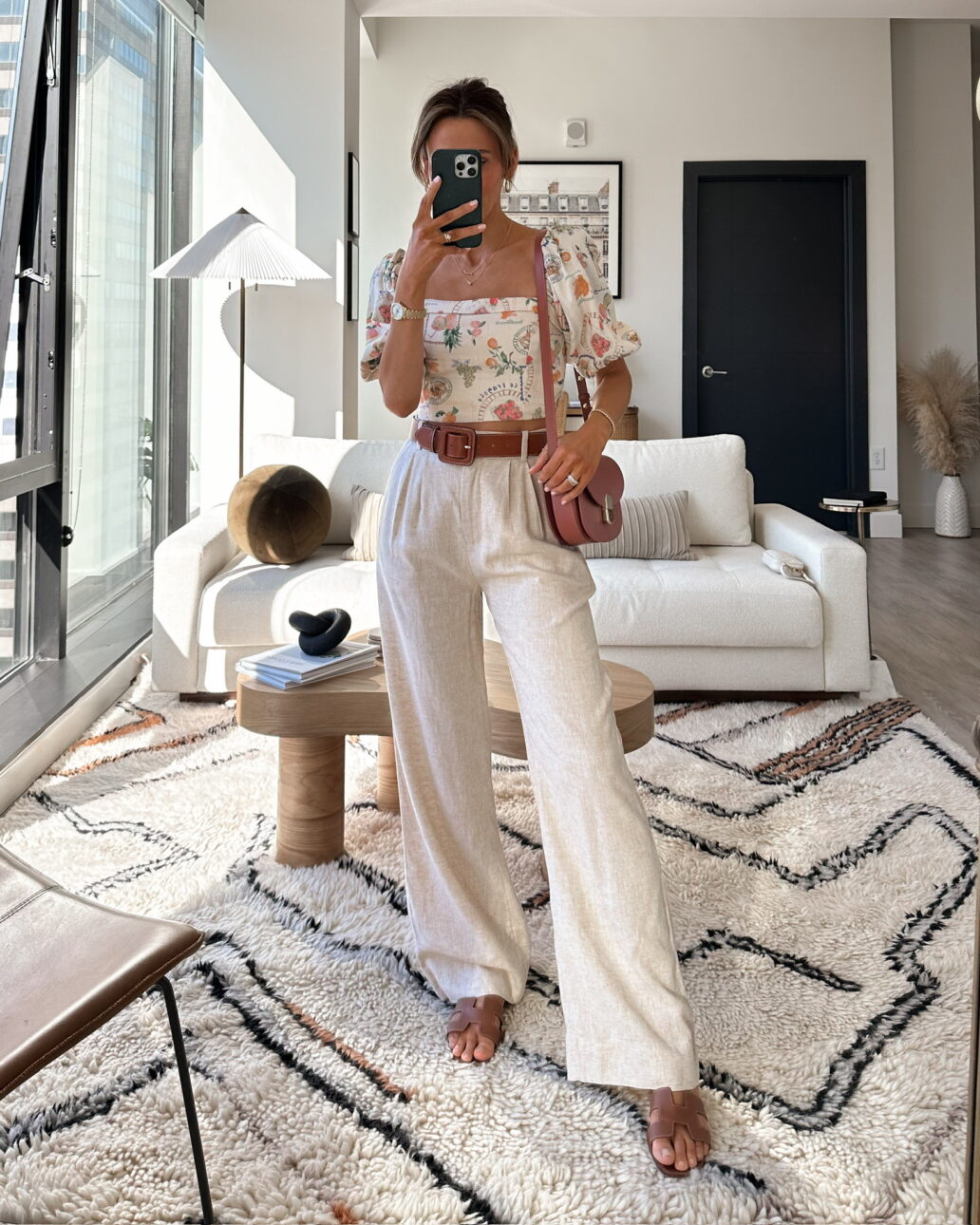 trouser outfit with puff sleeve top, belt, and sandals