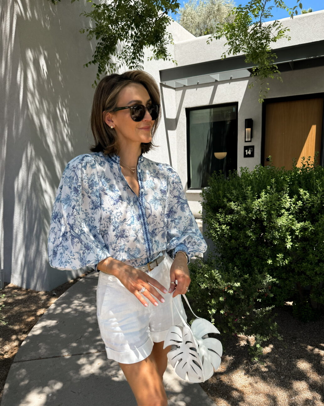 white linen shorts outfit with blue blouse