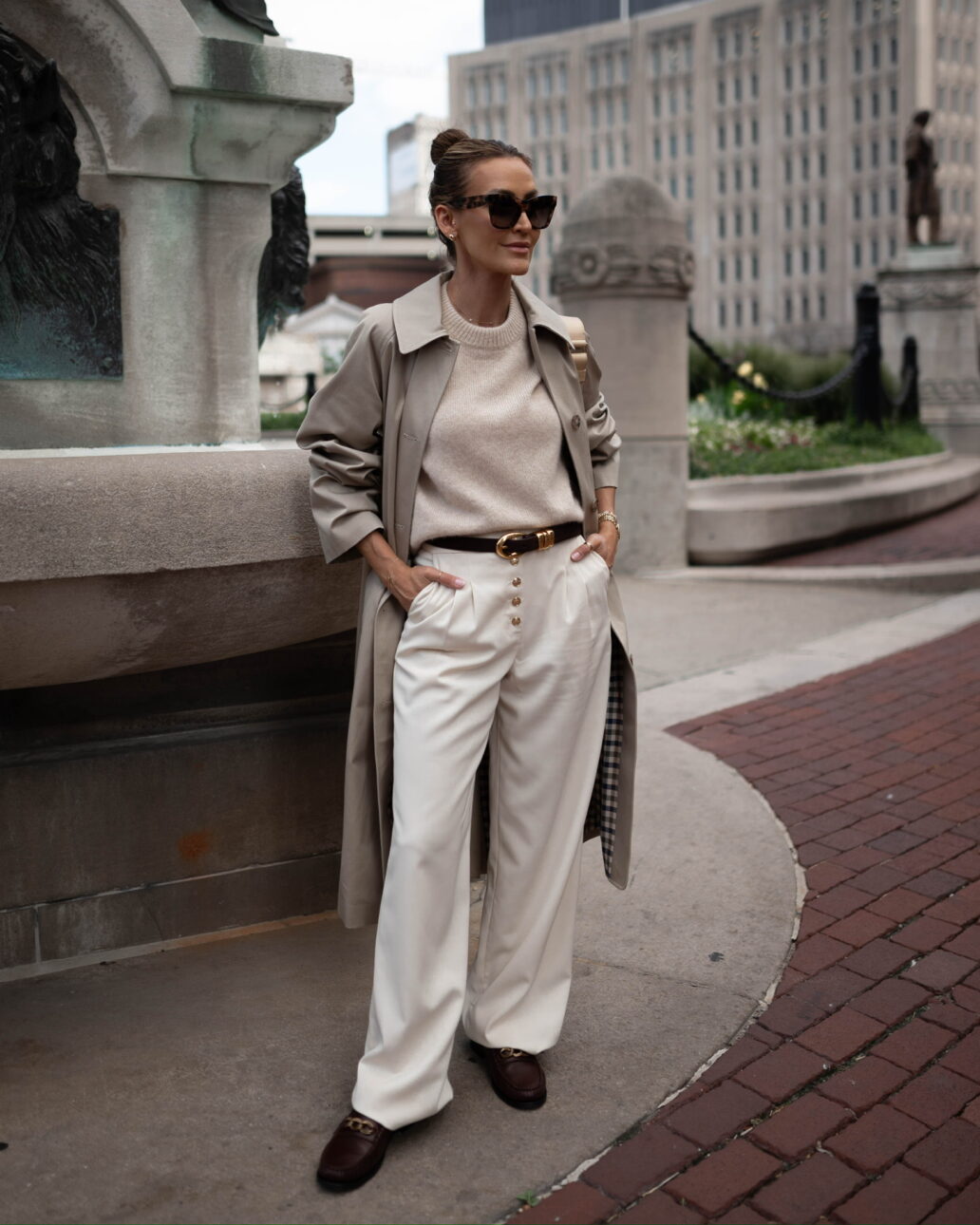 sezane trench coat outfit with trousers and loafers