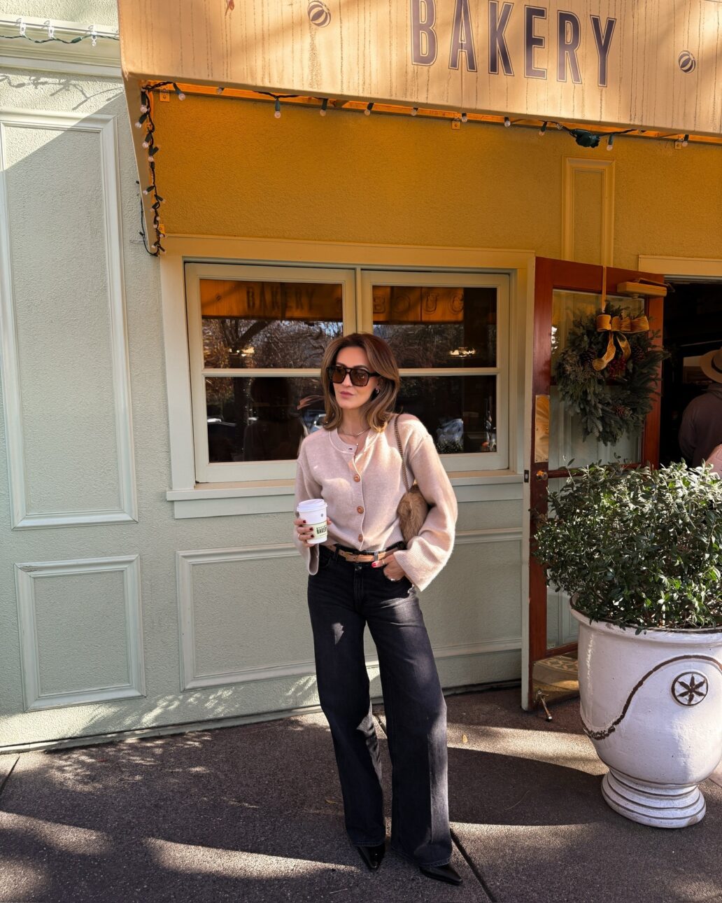 What to Wear Wine Tasting in the Winter Cardigan with Straight Leg Jeans and Boots