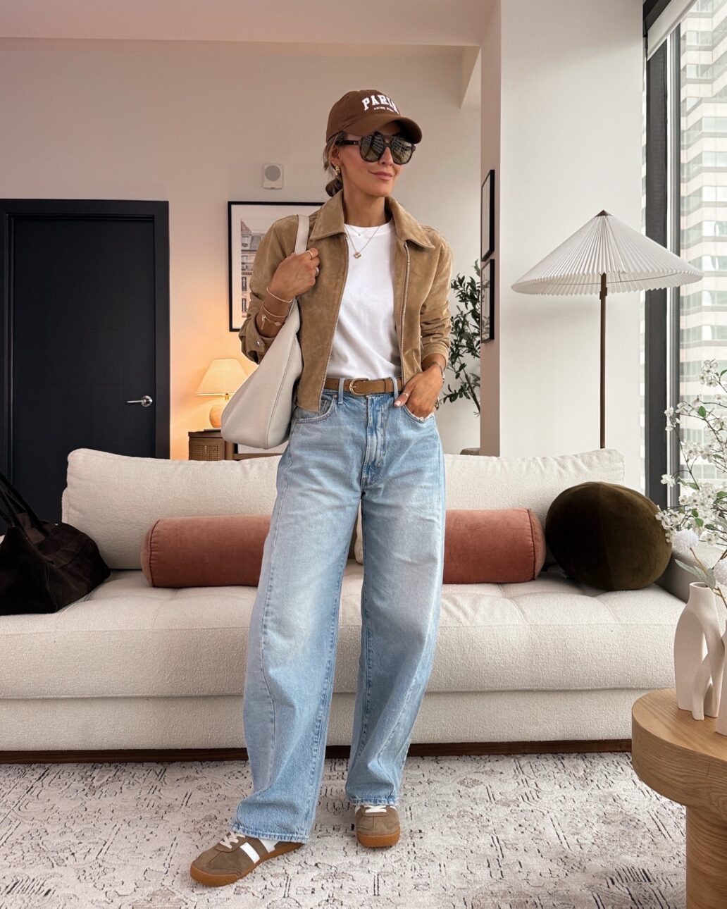 barrel leg jeans with a white t-shirt, sueded jacket, and suede sneakers