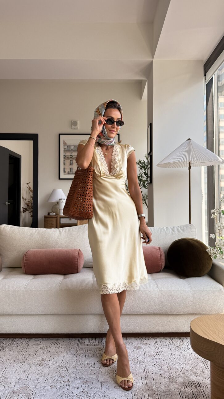 yellow silk dress with lace trim styled with a scarf, tote bag, and heels
